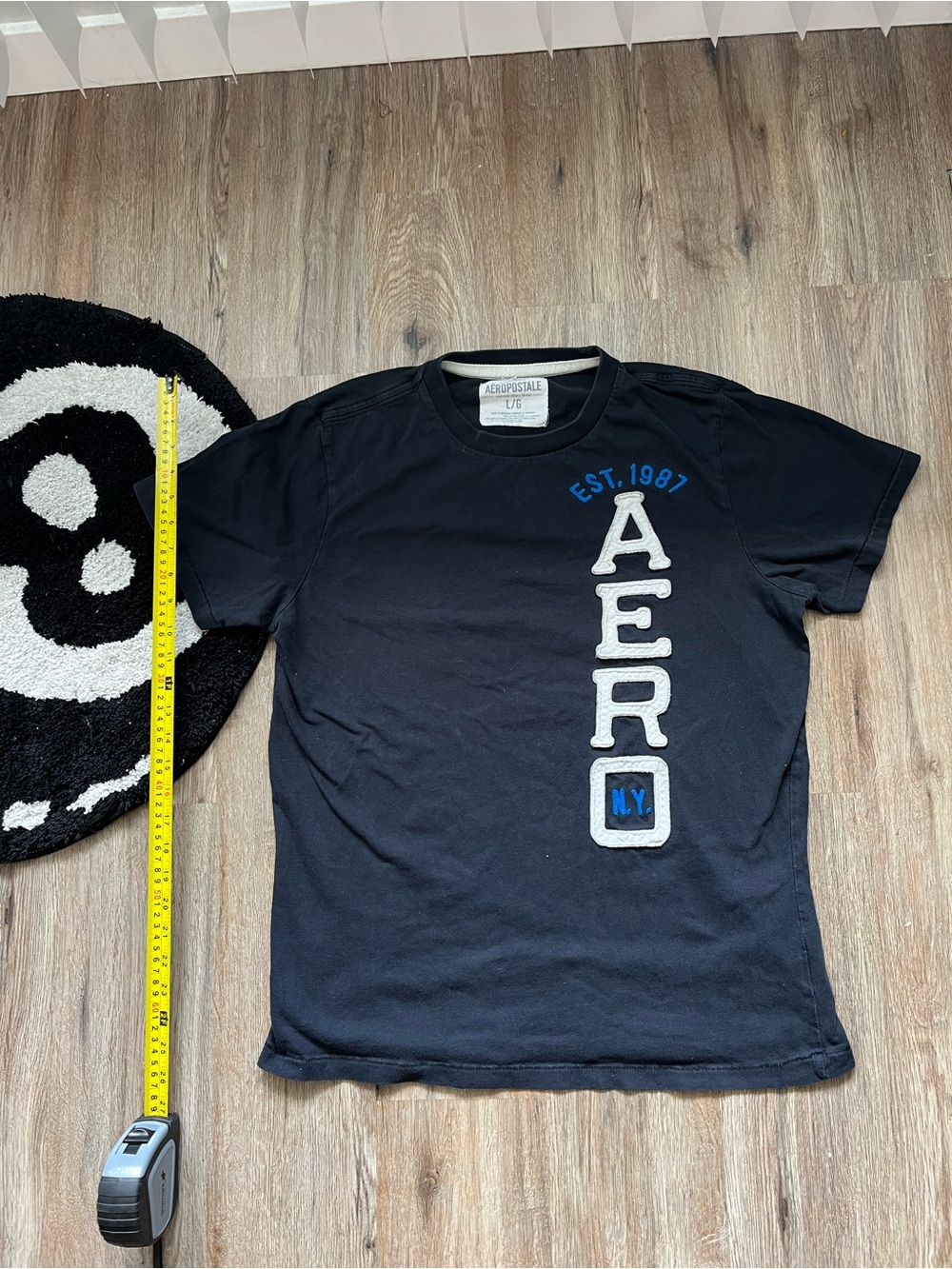 Vintage 2000s black Aeropostale large t-shirt featuring a vertical graphic print